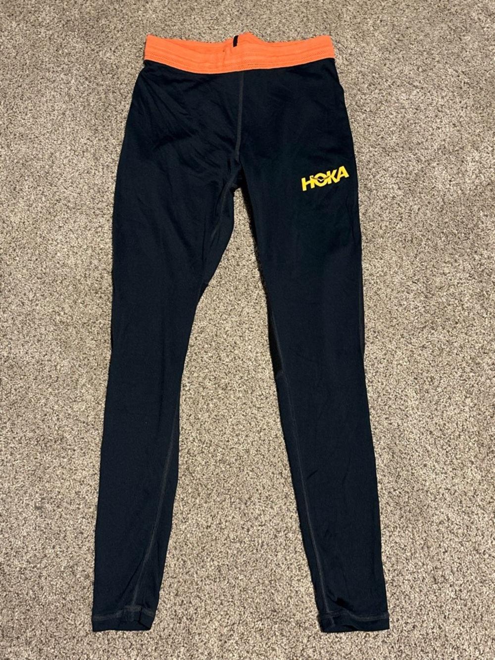 Hoka One One Black Leggings with Orange Waistband and Yellow HOKA Logo